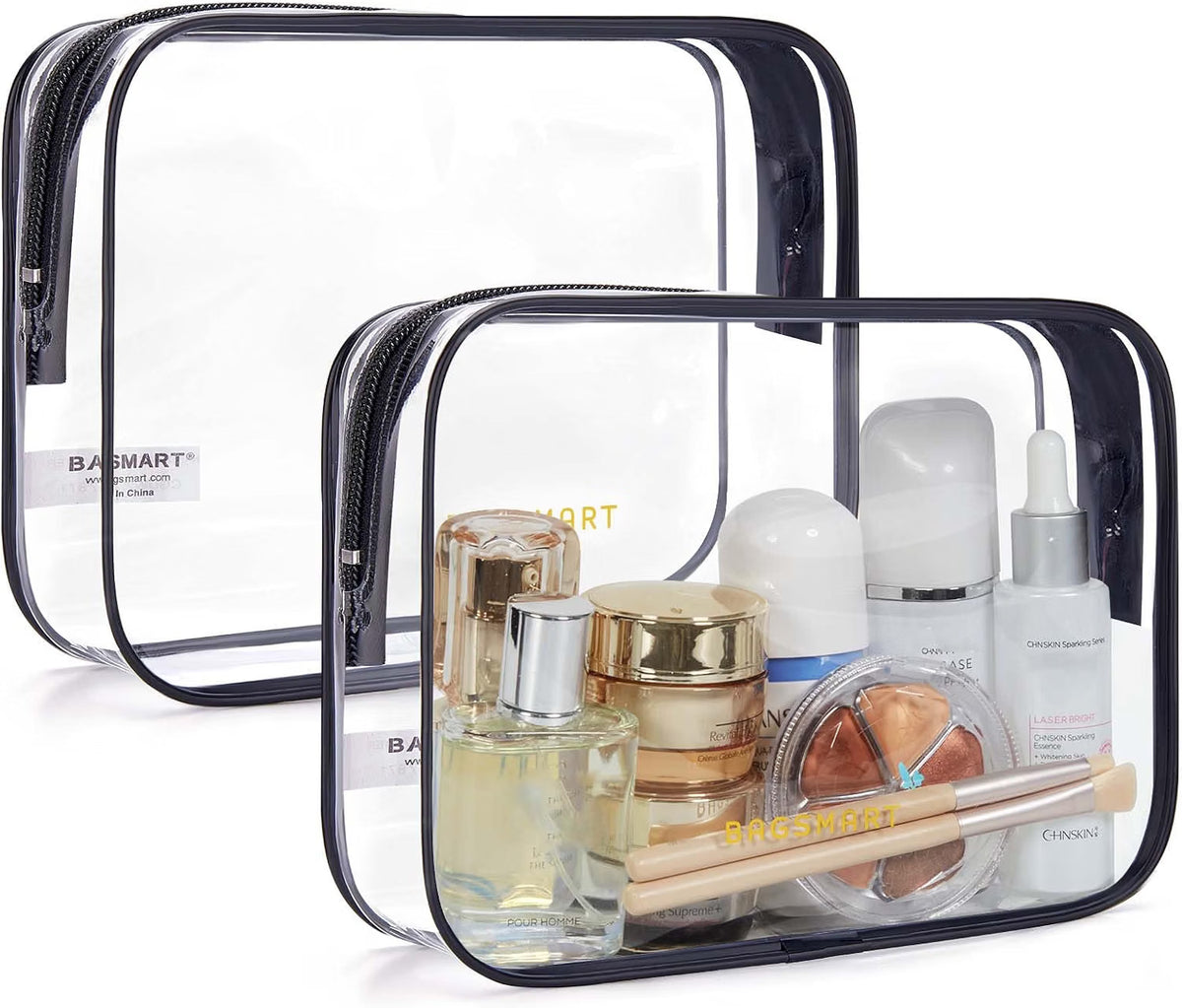 Two BAGSMART clear toiletry bags with black trim, one filled with perfume, skincare and makeup